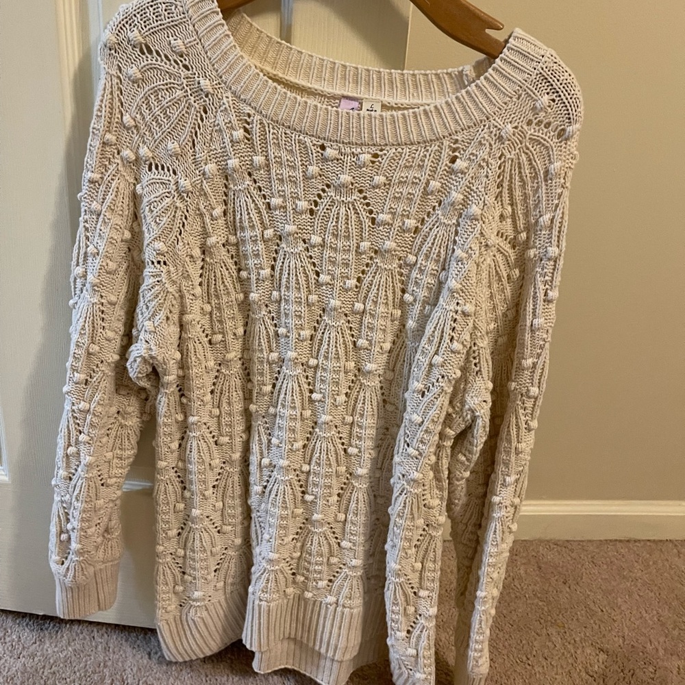 cream color sweater with textured pattern